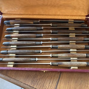 Set of 24 Art Deco knives with wooden handles and engraved metal ferrules, 1930