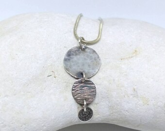 Multi textured sterling silver necklace