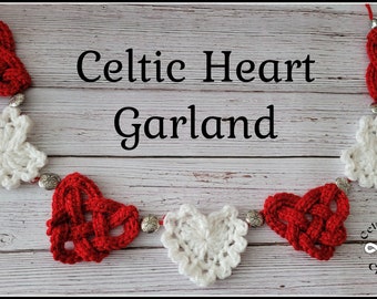 May include: A garland of crocheted Celtic knot hearts in red and white with silver beads. The garland is displayed on a whitewashed wood background. The text "Celtic Heart Garland" is displayed above the garland.