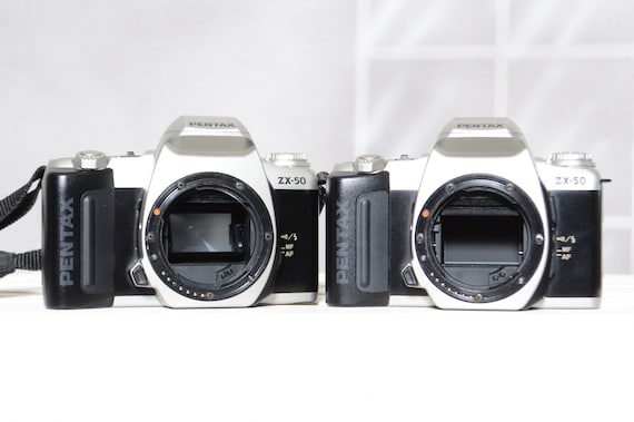 Two Vintage Pentax ZX-50 35mm film slr cameras for PARTS / REPAIR