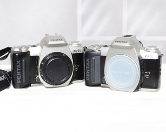 Two Vintage Pentax ZX-50 35mm film slr cameras for PARTS / REPAIR