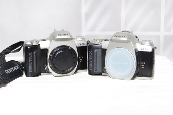 Two Vintage Pentax ZX-50 35mm film slr cameras for PARTS / REPAIR