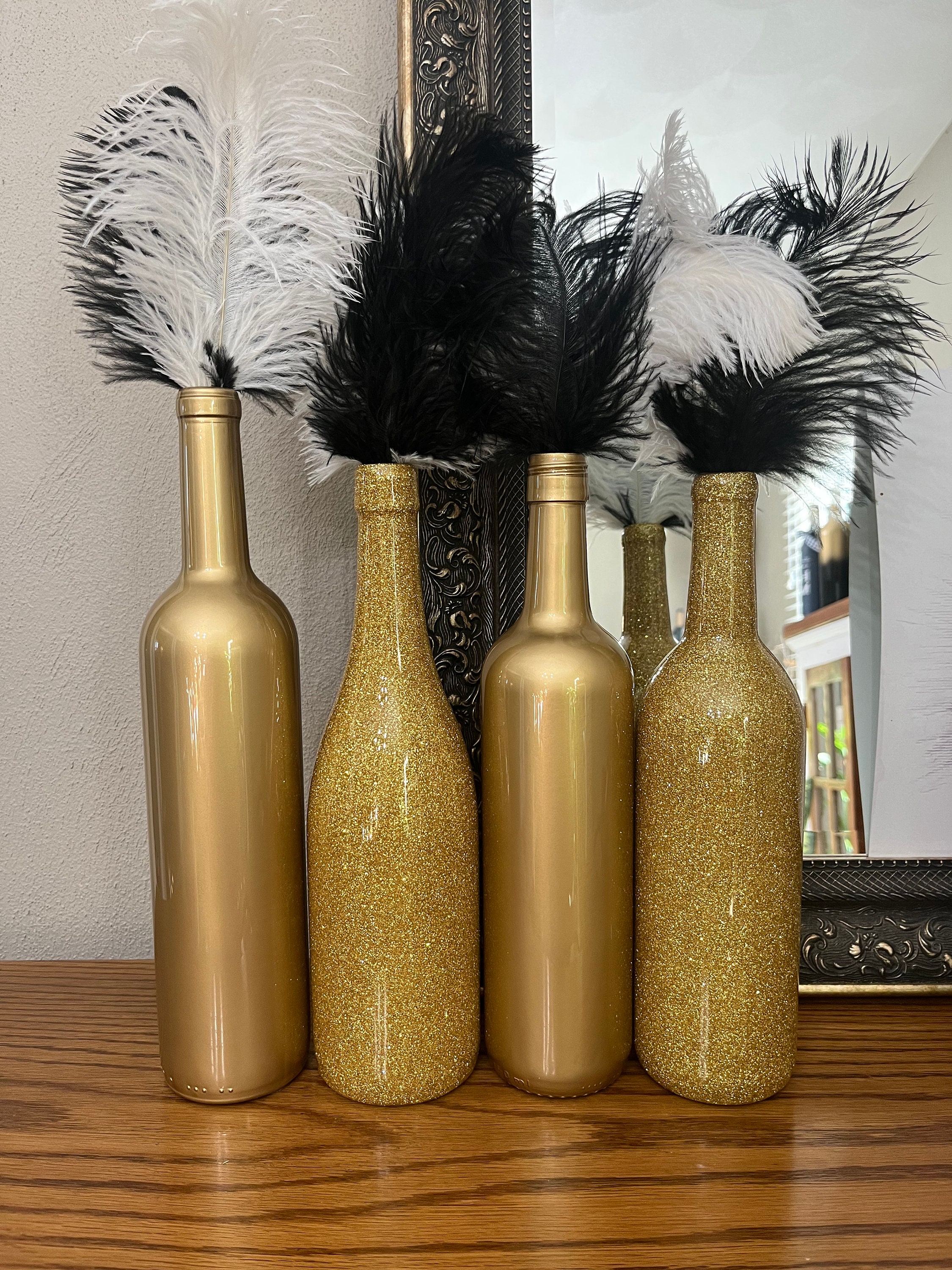 Black, white and gold party with glitter gold bottle centerpieces
