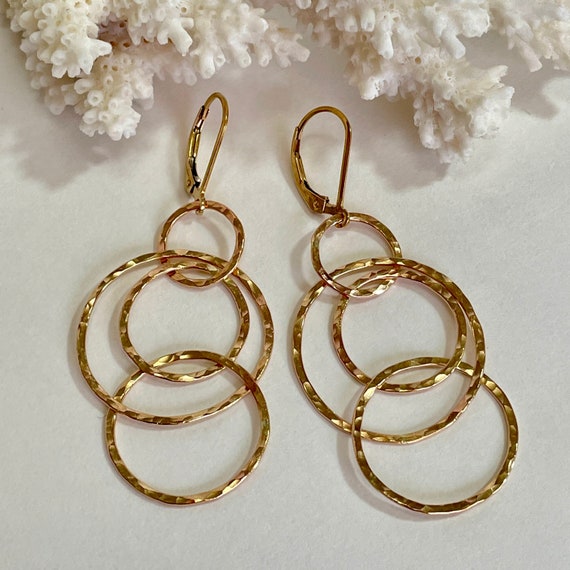 Interlocking gold hoop earrings discount