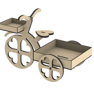 May include: A wooden tricycle with a heart-shaped seat and wheels. The tricycle has a small rectangular box on the back and a smaller box on the front. The boxes are open and appear to be for holding small items.