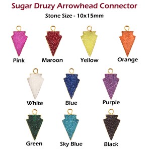 May include: Assortment of 10 arrowhead connectors made of druzy stone in various colors, including pink, maroon, yellow, orange, white, blue, purple, green, sky blue, and black. Each connector measures 10x15mm.