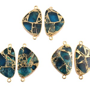 May include: Four gold-plated pendant connectors with a blue and green agate stone. The stones are irregularly shaped and have a gold foil inlay.