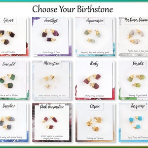 May include: A chart with 12 different birthstones, each with a small sample of the stone and a description of its meaning. The birthstones are Garnet, Amethyst, Aquamarine, Herkimer Diamond, Emerald, Moonstone, Ruby, Peridot, Sapphire, Pink Tourmaline, Citrine, and Turquoise.