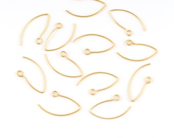 May include: A collection of gold-colored, wire earring components. Each piece has a curved, teardrop shape with a small loop at one end for attaching to other jewelry findings. The components are arranged on a white surface.