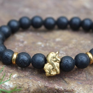 Black Golden Unicorn Bracelet Unisex Lava Stone Stainless Steel Stretch Bracelet for Women or Men Gift Modern