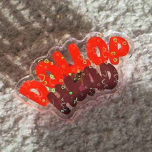 Merlin Dollophead holographic Pin badge