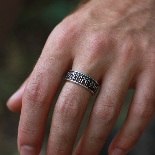 A ring with runes all the Elder Futhark, a gift for lovers of the Nordic culture, history, and Asatru, it can be personalized with engraving