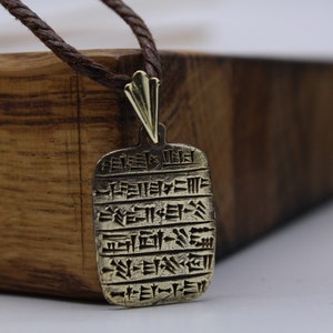 A pendant in the form of a clay tablet with cuneiform writing. A gift for archaeologists, lovers of Sumer, Babylon, Assyria, Bronze Age