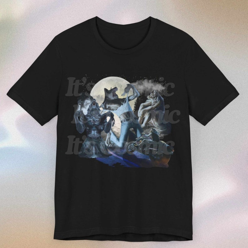 May include: Black t-shirt with a graphic of werewolves under a full moon. The design includes the text "It's Iconic" in a repeating pattern. The artwork depicts several werewolf figures in various poses, with a dark, atmospheric style.