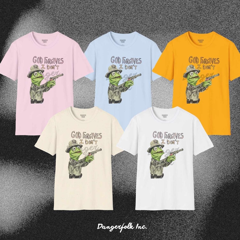 May include: Five t-shirts in different colors with a graphic of a green frog wearing a ranger hat and holding a gun. The text on the shirts reads "God Forgives I Don't".