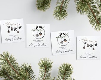 May include: Four square Christmas cards with watercolor illustrations and text. The cards feature black stars, pinecones, and ornaments. The text reads "Wishing you all a very Merry Christmas" and "From our house to yours, Merry Christmas."