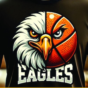 May include: A digital download of a graphic design featuring a basketball and an eagle head with the word "EAGLES" below. The design is on a black t-shirt.