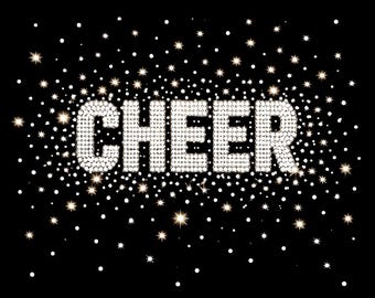 May include: The word CHEER is displayed in a bold, block-letter font composed of shimmering silver rhinestones. The text is surrounded by a dense field of scattered white dots and small, multi-pointed starbursts against a solid black background.