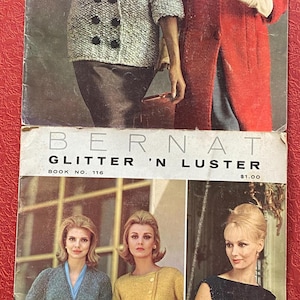 May include: Two vintage fashion magazines featuring women modeling knitted clothing. The top magazine cover reads "BIG-NEEDLE FASHIONS FROM BERNAT." The bottom magazine cover reads "BERNAT GLITTER 'N LUSTER." The magazines showcase various knitted coats, dresses, and skirt suits.