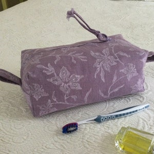 Purple linen toiletries bag. Floral block print cosmetics case. Washable cloth travel kit. Made in Maine.