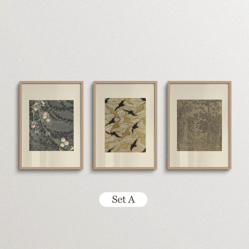 Set of 3 vintage botanical and patterned wall art prints in natural oak frames with ivory borders. Featuring muted green floral illustrations, a beige organic textile-inspired pattern and an antique tree drawing, this coordinated gallery wall set brings earthy colors and layered vintage details to Japandi living rooms and eclectic interiors.