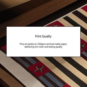 May include: A close-up of a colorful rug with a geometric pattern. The rug features red, black, and beige stripes and a central design. The image also includes a white rectangle with the text "Print Quality".