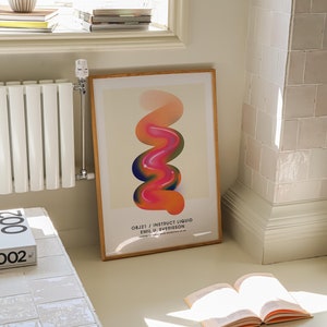 May include: A framed poster with a colorful abstract design of a swirling, liquid-like shape in shades of orange, pink, and blue. The poster is titled "OBJ21 / INSTRUCT LIQUID EMIL U. SVERISSON".