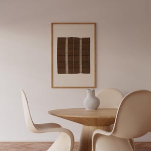 Brown Wabi Sabi wall art print in a natural wood frame, featuring a vintage textile-style checker pattern for a neutral Japandi dining room.