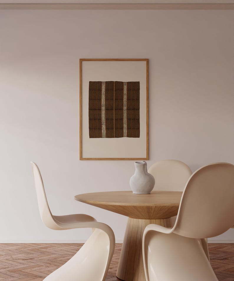 Brown Wabi Sabi wall art print in a natural wood frame, featuring a vintage textile-style checker pattern for a neutral Japandi dining room.