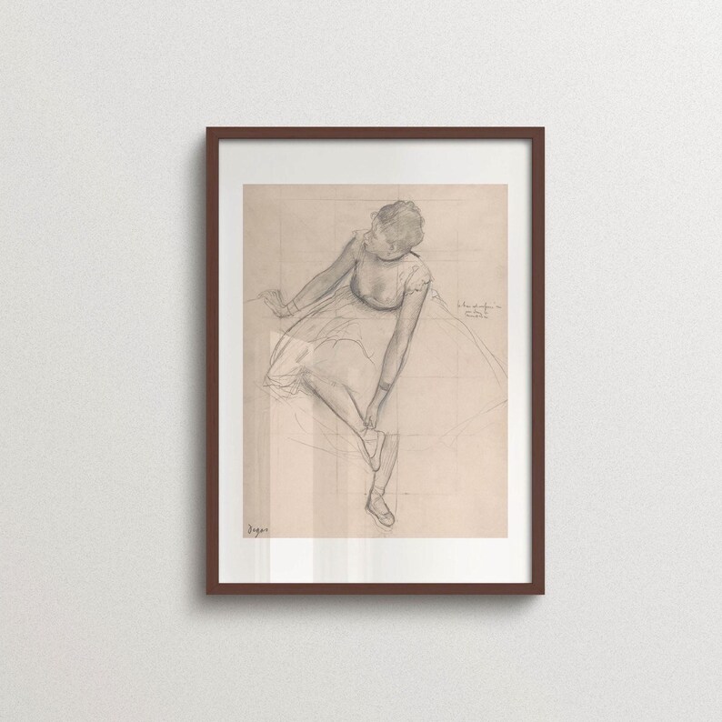 Vintage Edgar Degas ballerina sketch print in a walnut wood frame featuring a graceful seated dancer in soft graphite lines. Classic ballet wall art inspired by French Impressionism, ideal for gallery walls, Parisian interiors, wabi sabi, Japandi, Scandinavian, and timeless home decor.