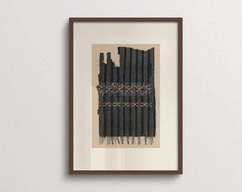 May include: A framed textile art piece featuring a dark fabric with vertical stripes and two horizontal bands of intricate, light-colored geometric embroidery. The fabric has a frayed, uneven top edge and a fringed bottom edge, set in a brown frame.