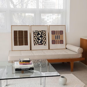 Set of 3 textile wall art prints in natural oak frames. Vintage woven pattern gallery wall for living rooms, dining rooms, Scandinavian interiors, and curated modern homes.