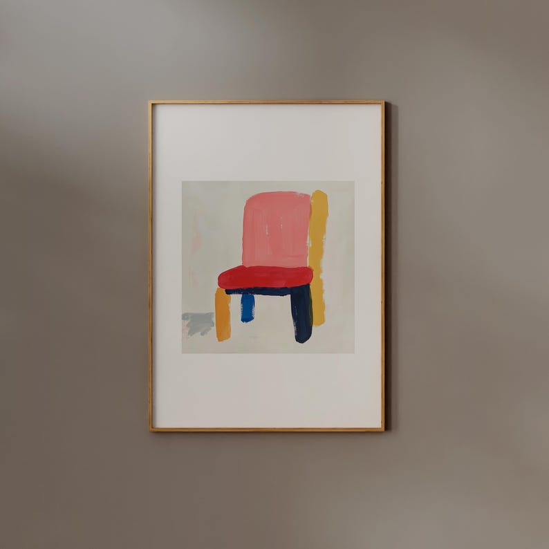 May include: A framed abstract painting of a chair with a pink seat, red cushion, yellow and blue legs, and a white background.