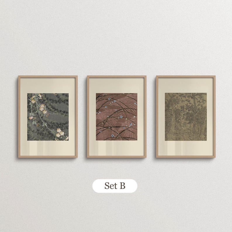 Neutral floral wall art set of 3 featuring delicate white blossoms, a vintage garden illustration and a detailed botanical tree print. Displayed in matching light wood frames with wide cream borders, this soft sage green and beige gallery arrangement suits cottagecore bedrooms, traditional interiors and nature-inspired home decor.
