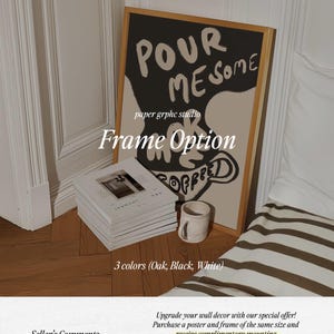 May include: A framed art print with the text "POUR MESOME" and "paper grphc studio" in black and white. The frame is available in oak, black, or white.