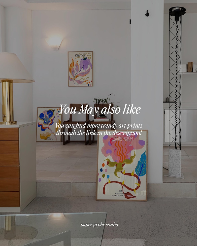May include: Three framed abstract art prints with colorful floral designs. The prints are hanging on a white wall in a modern home interior. The text "You May also like" and "You can find more trendy art prints through the link in the description!" is visible below the prints. The text "paper grphc studio" is visible at the bottom of the image.