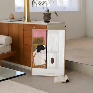 May include: A framed print of a painting depicting a woman in a pink room. The painting is titled "Mirror, Onoda Kenzan (Japanese, 1891-1952)".