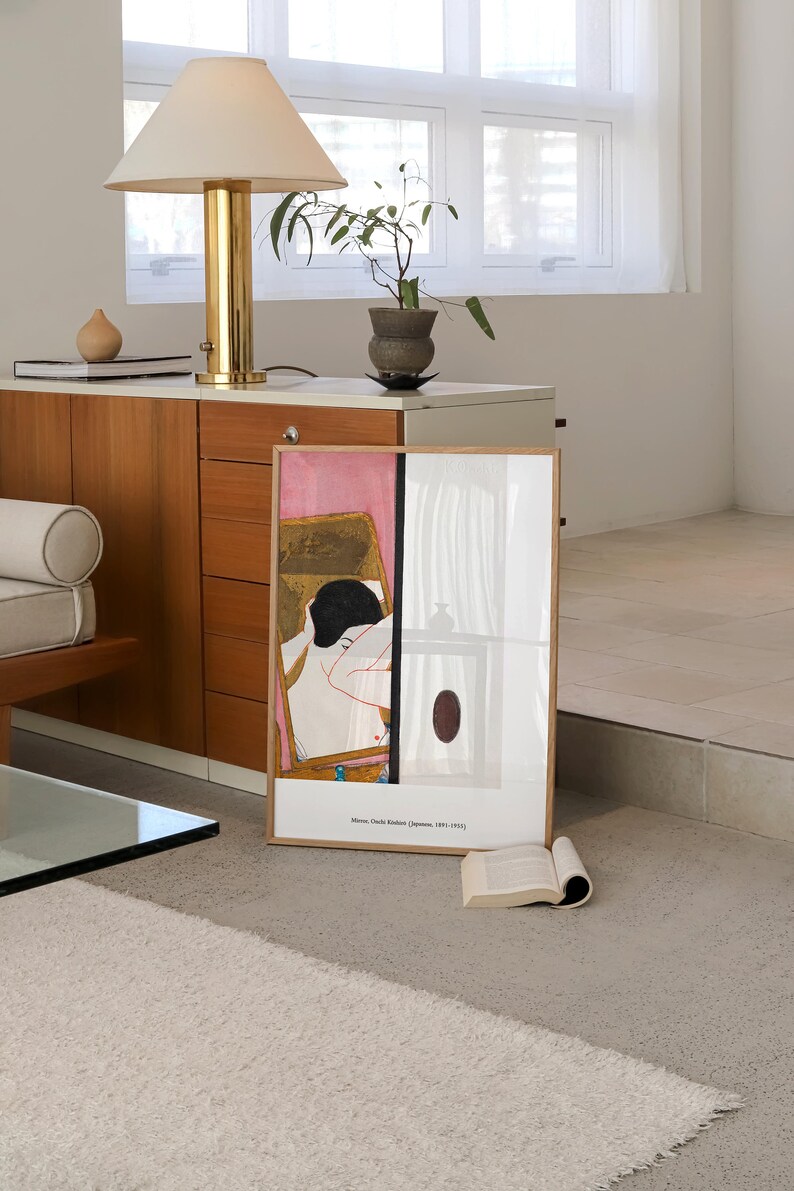 May include: A framed print of a painting depicting a woman in a pink room. The painting is titled "Mirror, Onoda Kenzan (Japanese, 1891-1952)".