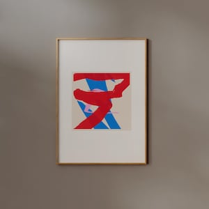 May include: A framed abstract painting with bold strokes of red, blue, and pink paint on a white background.