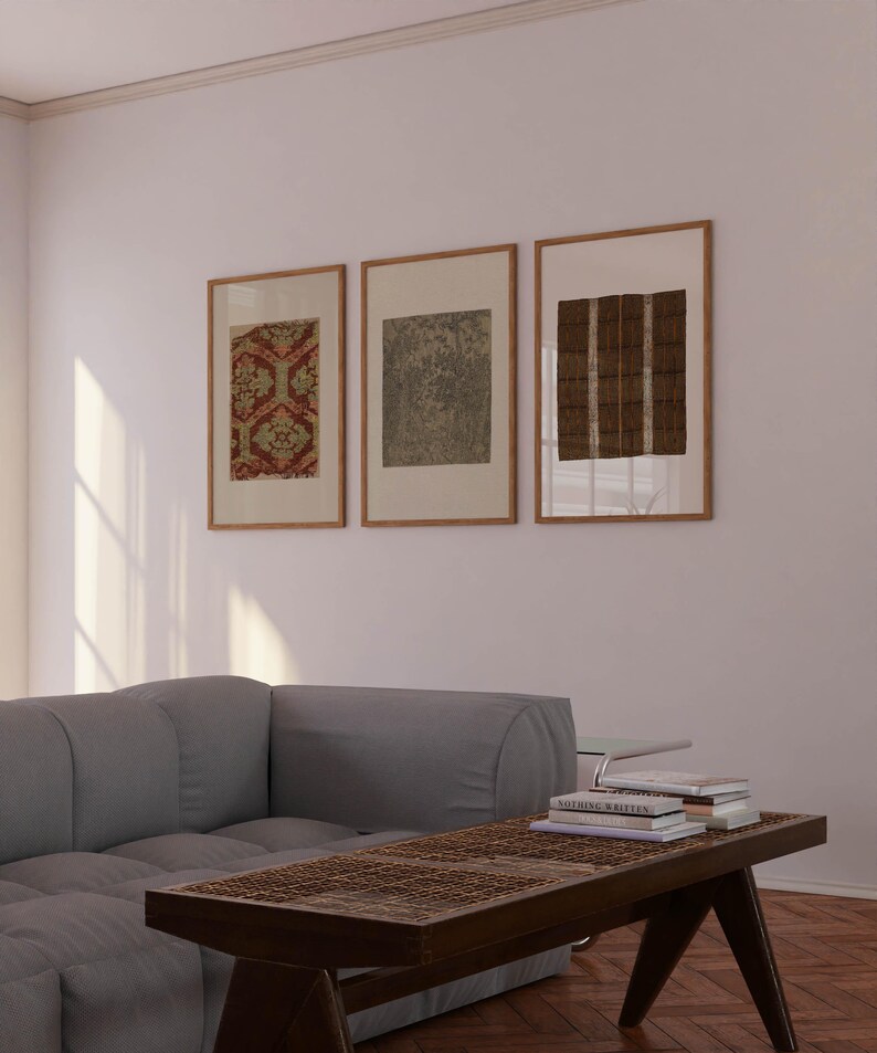 Earth tone textile wall art set in a calm wabi sabi inspired living room with natural materials and vintage decorative patterns