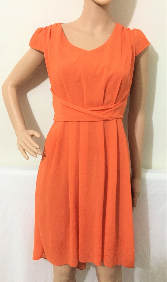 orange knee length dress