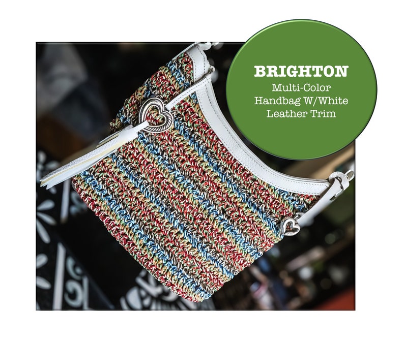 May include: A multi-colored striped handbag with white leather trim. The handbag has a heart-shaped charm and the brand name "BRIGHTON" is visible in the image.