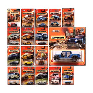 May include: A collection of nineteen Matchbox die-cast toy vehicles in their original orange and white blister card packaging. The assortment includes various car and truck models, featuring a prominent blue Jeep Gladiator on a larger card.
