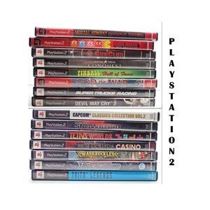 May include: A stack of 15 PlayStation 2 video game cases. The games include Mortal Kombat Shaolin Monks, Pac-Man World Rally, Star Trek Conquest, Gun Club, Pinball Hall of Fame, God of War, Super Trucks Racing, Devil May Cry 2, Capcom Classics Collection Vol. 2, Snowblind, Tetris Worlds, High Rollers Casino, Swashbucklers, Underground, and Taito Legends.
