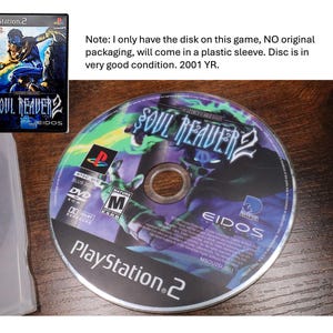 May include: A PlayStation 2 game disc for Soul Reaver 2. The disc has a colorful graphic with the game's title and logo. The disc is in very good condition and comes in a plastic sleeve. The game is rated M for Mature.