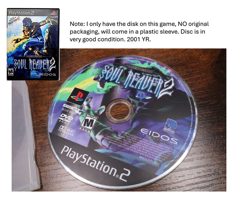 May include: A PlayStation 2 game disc for Soul Reaver 2. The disc has a colorful graphic with the game's title and logo. The disc is in very good condition and comes in a plastic sleeve. The game is rated M for Mature.