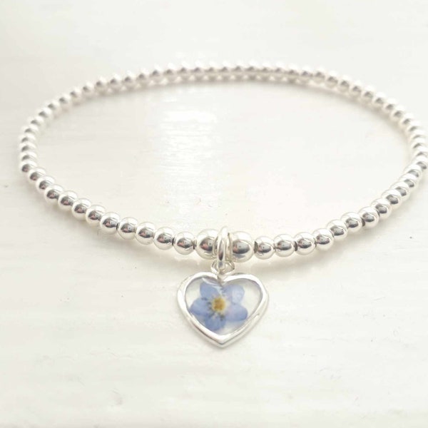Sterling silver and real pressed forget me not flower beaded stretch stacking bracelet. Forget me not bracelet