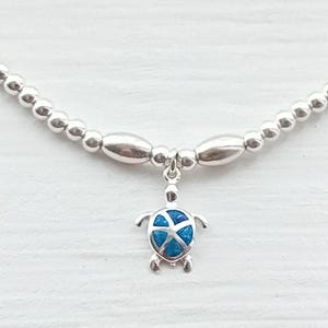 Sterling zilveren kralenarmband met opalen schildpadhanger