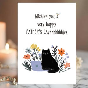 May include: A Father's Day greeting card with the text "Wishing you a very happy FATHER'S DAY" and a black cat using a laptop. The card features colorful flowers and a small blue bird illustration.