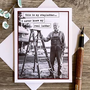 May include: A black and white greeting card featuring a vintage photograph of an older man in overalls standing next to a wooden step ladder. The card has text that reads, "this is my stepladder... I never knew my real ladder."